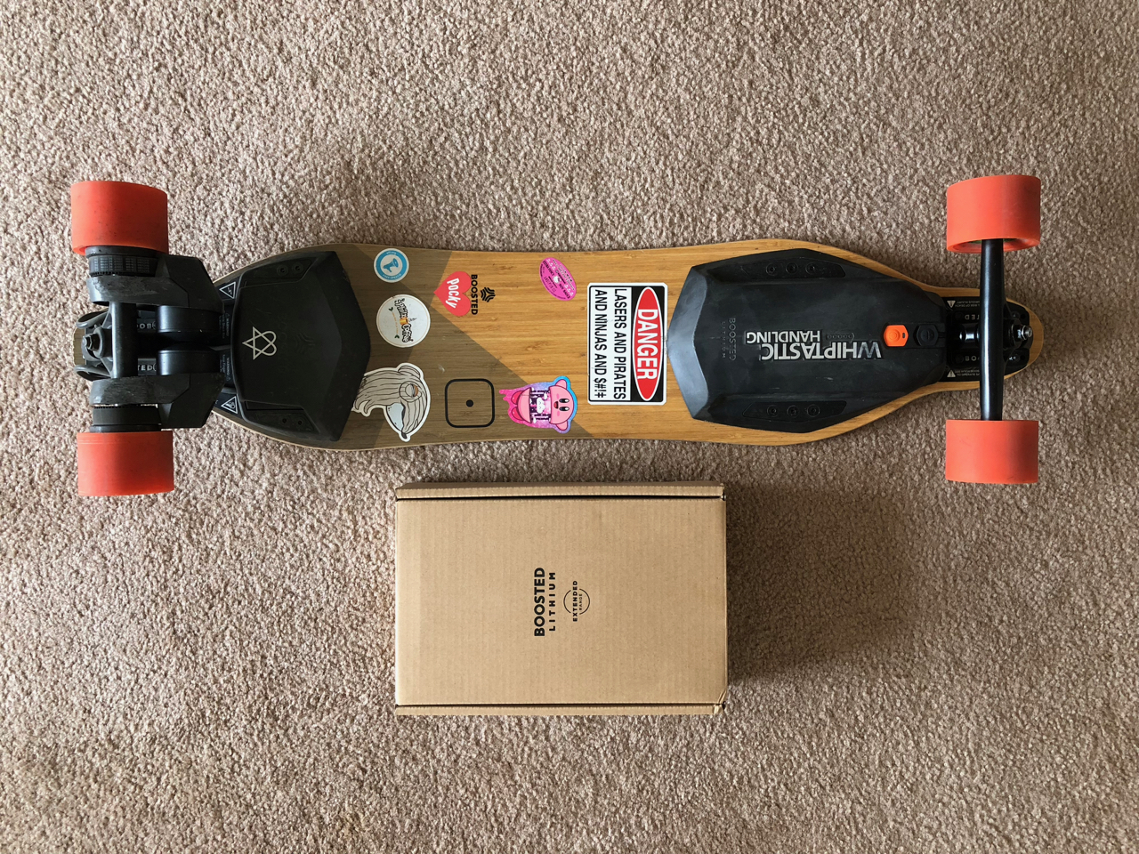 My Boosted Board Next To The Extended Battery Shipping Box